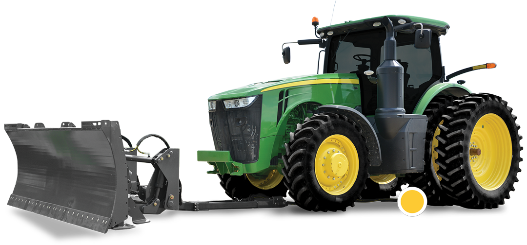 A Pitbull FWA blade still connected to the D2X Undermount system is disconnected from the green John Deere tractor. A large yellow dot is highlighted on the rear portion of the undermount located under the tractor showing that the undermount system has been disconnected.